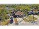 Aerial view of the property showcasing the house, driveway, and landscaping at 3212 W Hartnett Ave, Tampa, FL 33611