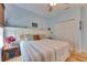 Bright bedroom featuring wood floors, window with blinds and closet at 329 Laurel Falls Dr, Apollo Beach, FL 33572