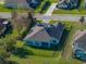 Aerial view of a single-Gathering home featuring a backyard with a fence and covered patio at 34411 Sahalee Loop, Dade City, FL 33525