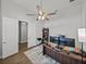 Spacious home office with a ceiling fan, modern desk area, and an open doorway at 34411 Sahalee Loop, Dade City, FL 33525