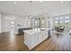 The kitchen island provides seating with views to the dining and living area at 34411 Sahalee Loop, Dade City, FL 33525