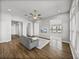 Inviting living room featuring hardwood floors, neutral paint, and a large window for natural light at 34411 Sahalee Loop, Dade City, FL 33525