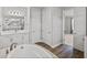 This bathroom features a soaking tub with a tile surround and dual sinks at 34411 Sahalee Loop, Dade City, FL 33525