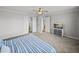 This main bedroom features plush carpeting, closet, and television on a dresser at 34411 Sahalee Loop, Dade City, FL 33525