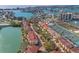 Aerial view showcasing the community with waterfront access, pool, and tennis courts at 442 Sandy Hook Rd, Treasure Island, FL 33706