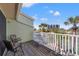 Relaxing balcony with seating overlooking lush greenery, creating a peaceful outdoor retreat at 442 Sandy Hook Rd, Treasure Island, FL 33706
