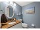 Well-lit bathroom features a vanity with a unique countertop and modern fixtures at 442 Sandy Hook Rd, Treasure Island, FL 33706