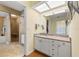Bright bathroom featuring a granite-topped vanity, and walk-in shower at 442 Sandy Hook Rd, Treasure Island, FL 33706
