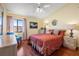 Bedroom featuring bright yellow walls, wood floors, and matching furniture at 442 Sandy Hook Rd, Treasure Island, FL 33706