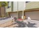 Exterior view of townhouses with garages, patios, and well-kept landscaping at 442 Sandy Hook Rd, Treasure Island, FL 33706