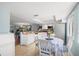 Bright kitchen with tile floors and a breakfast table for casual dining, fostering a cozy atmosphere at 442 Sandy Hook Rd, Treasure Island, FL 33706