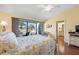 Tranquil main bedroom with balcony access, offering serene views and natural light at 442 Sandy Hook Rd, Treasure Island, FL 33706