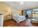 Comfortable main bedroom with a walkout to a private deck offering a great view at 442 Sandy Hook Rd, Treasure Island, FL 33706