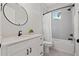 Classic white bathroom with marble countertop and sleek black fixtures at 445 29Th N Ave, St Petersburg, FL 33704