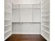 Walk-in closet with custom shelving and hanging rods for optimized storage at 445 29Th N Ave, St Petersburg, FL 33704
