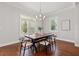 Dining room with wood table, modern chairs, plantation shutters, and natural light at 445 29Th N Ave, St Petersburg, FL 33704