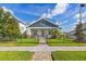 Charming home featuring a beautifully landscaped front yard with a decorative fence and walkway at 445 29Th N Ave, St Petersburg, FL 33704