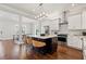 Modern kitchen with stainless steel appliances, granite countertops, dark wood island, and hardwood floors at 445 29Th N Ave, St Petersburg, FL 33704