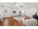 Bright living room with hardwood floors, neutral furniture, and plenty of natural light at 445 29Th N Ave, St Petersburg, FL 33704