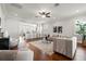 Open-concept living room featuring hardwood floors, a comfortable sofa, and lots of light at 445 29Th N Ave, St Petersburg, FL 33704