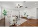 Airy living room featuring wood floors, neutral decor, and a view to the entryway at 445 29Th N Ave, St Petersburg, FL 33704