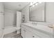 Bright bathroom offers a shower/tub combo, modern vanity, and neutral tones at 5120 Bridge St # 6, Tampa, FL 33611