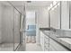 Stylish bathroom with glass-enclosed shower and granite countertops at 5120 Bridge St # 6, Tampa, FL 33611