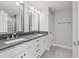 Modern bathroom boasts a dual vanity with granite countertops and sleek chrome fixtures at 5120 Bridge St # 6, Tampa, FL 33611