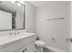 Clean bathroom featuring single sink vanity with quartz countertop and a toilet at 5120 Bridge St # 6, Tampa, FL 33611