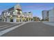Exterior view of the shopping center with well lit restaurants and shops at twilight at 5120 Bridge St # 6, Tampa, FL 33611