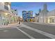 Daytime view of mixed use development featuring shops and a high rise condo building at 5120 Bridge St # 6, Tampa, FL 33611