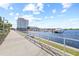 Beautiful waterfront with a sidewalk, palm trees, and modern high-rise buildings at 5120 Bridge St # 6, Tampa, FL 33611