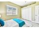 Brightly-lit bedroom with tile floors and a large closet for ample storage at 5384 Mira Vista Dr, Palm Harbor, FL 34685