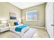 Bright bedroom with a queen-sized bed, tile floors, and ample natural light from the large window at 5384 Mira Vista Dr, Palm Harbor, FL 34685