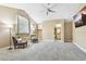 Upstairs bonus room featuring carpeted floors, comfortable seating, and lots of natural light at 5384 Mira Vista Dr, Palm Harbor, FL 34685