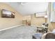 Upstairs bonus room with carpeted floors, neutral walls, and a view of the staircase at 5384 Mira Vista Dr, Palm Harbor, FL 34685