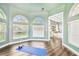 Bonus room featuring a yoga mat, windows, with access to the main bedroom at 5384 Mira Vista Dr, Palm Harbor, FL 34685