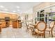 Eat-in dining area features modern table set near kitchen and an adjacent living room at 5384 Mira Vista Dr, Palm Harbor, FL 34685