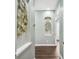 Hallway with unique design elements and dark wood floor at 5384 Mira Vista Dr, Palm Harbor, FL 34685