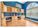 Stylish home office features custom cabinetry and a large window for natural light at 5384 Mira Vista Dr, Palm Harbor, FL 34685