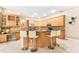 Gourmet kitchen with stainless steel appliances, granite countertops, and center island with seating at 5384 Mira Vista Dr, Palm Harbor, FL 34685