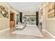 Open living room with fireplace and view of the outdoor pool and patio area at 5384 Mira Vista Dr, Palm Harbor, FL 34685
