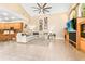 Inviting living room with tile floors, large windows, and a view of the kitchen area at 5384 Mira Vista Dr, Palm Harbor, FL 34685