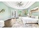Tranquil main bedroom suite featuring wood floors, and French doors offering plenty of natural light at 5384 Mira Vista Dr, Palm Harbor, FL 34685