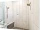 Modern shower features dual shower heads, stone accents, and glass enclosure for a spa-like experience at 5384 Mira Vista Dr, Palm Harbor, FL 34685
