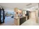 Open kitchen with granite countertops and stainless steel appliances at 5700 Escondida S Blvd # 506, St Petersburg, FL 33715