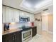Bright kitchen features stainless steel appliances, modern countertops, and under cabinet lighting at 5700 Escondida S Blvd # 506, St Petersburg, FL 33715