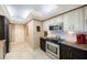 Updated kitchen with stainless steel appliances and granite countertops at 5700 Escondida S Blvd # 506, St Petersburg, FL 33715