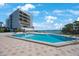 Enjoy the community pool with the lovely view of the bay and the blue skies at 5700 Escondida S Blvd # 506, St Petersburg, FL 33715