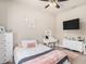 Cozy bedroom featuring a soft color palette, a plush rug, and modern decor at 6617 Park Strand Dr, Apollo Beach, FL 33572
